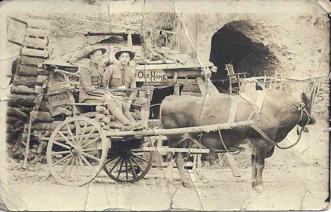 E F Russell and friend posing for a novelty postcard outside famous Hot Springs, Arkansas crystal mines